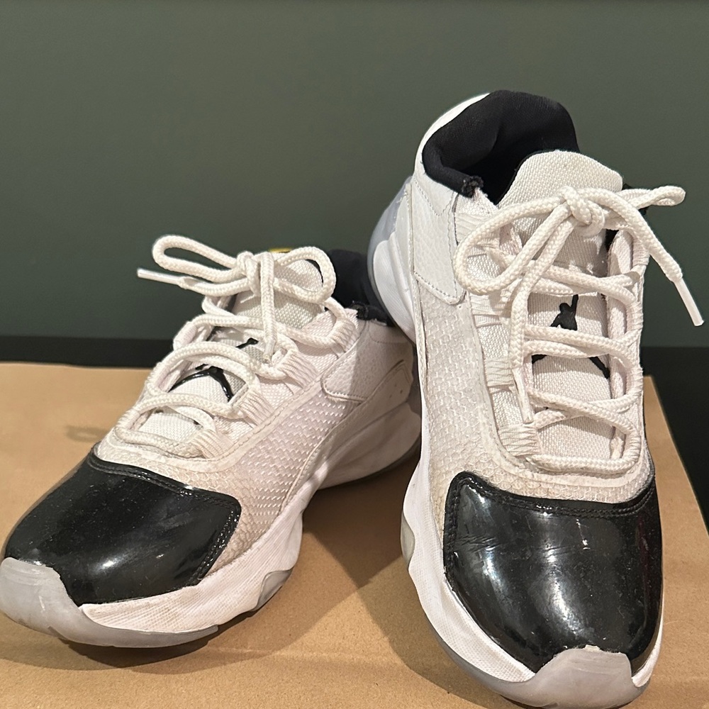 Nike AJ11 low for boy’s size 4Y in white and black